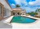 Stunning pool and patio area with ample space for relaxation and entertaining at 815 Tropical Cir, Sarasota, FL 34242
