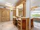 Luxurious bathroom with a vanity, large mirror and separate shower at 815 Tropical Cir, Sarasota, FL 34242