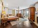 Main bedroom with king-size bed, fireplace, and large windows at 815 Tropical Cir, Sarasota, FL 34242