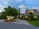 Brick home with a charming courtyard and well-manicured landscaping at 815 Tropical Cir, Sarasota, FL 34242