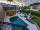 Inviting pool area with patio furniture and lush landscaping at 815 Tropical Cir, Sarasota, FL 34242