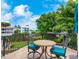 Private patio with table and chairs offering scenic water views at 815 Tropical Cir, Sarasota, FL 34242