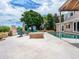 Brick patio with fire pit, comfortable seating, and beautiful pool view at 815 Tropical Cir, Sarasota, FL 34242