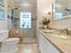 Clean bathroom with updated fixtures and a large walk-in shower at 815 Tropical Cir, Sarasota, FL 34242