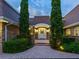 Elegant front entry with brick walkway and lush landscaping at 815 Tropical Cir, Sarasota, FL 34242