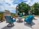 Relaxing patio furniture around a fire pit and overlooking the pool at 815 Tropical Cir, Sarasota, FL 34242
