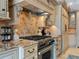 Modern kitchen features granite counters, stainless steel appliances, and tile backsplash at 815 Tropical Cir, Sarasota, FL 34242