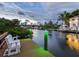 White bench on a wooden dock overlooking the canal at 815 Tropical Cir, Sarasota, FL 34242