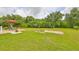 Landscaped backyard oasis with putting green at 17706 Bridlewood Ct, Parrish, FL 34219