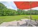 Landscaped backyard with a putting green and patio seating at 17706 Bridlewood Ct, Parrish, FL 34219