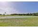 Outdoor basketball court with two hoops at 17706 Bridlewood Ct, Parrish, FL 34219