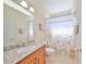 Clean bathroom with granite countertop and shower at 17706 Bridlewood Ct, Parrish, FL 34219