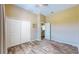 Comfortable bedroom with wood-look floors, a closet, and a door leading to the bathroom, creating a cozy atmosphere at 17706 Bridlewood Ct, Parrish, FL 34219