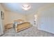 Spacious bedroom with tiled floors and a large bed at 17706 Bridlewood Ct, Parrish, FL 34219