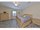 Spacious bedroom with large window and tiled floors at 17706 Bridlewood Ct, Parrish, FL 34219