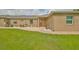 Landscaped yard with walkway leading to a red front door at 17706 Bridlewood Ct, Parrish, FL 34219