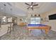 Spacious game room features a pool table, and views of the backyard at 17706 Bridlewood Ct, Parrish, FL 34219