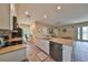 Modern kitchen with granite countertops and white cabinets at 17706 Bridlewood Ct, Parrish, FL 34219