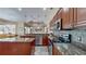Well-equipped kitchen boasts stainless steel appliances, granite countertops, and ample cabinet space at 17706 Bridlewood Ct, Parrish, FL 34219