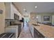 Modern kitchen boasts granite counters, stainless appliances and ample cabinet space at 17706 Bridlewood Ct, Parrish, FL 34219