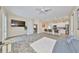 Open-concept living room with kitchen, tile floors, and modern finishes creates a welcoming space at 17706 Bridlewood Ct, Parrish, FL 34219