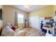 Home office with desk, chair, and built-in shelving at 17706 Bridlewood Ct, Parrish, FL 34219