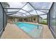 Inviting pool and spa with covered lanai and basketball hoop at 17706 Bridlewood Ct, Parrish, FL 34219