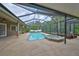 Backyard pool and spa enclosed in a screened lanai at 17706 Bridlewood Ct, Parrish, FL 34219