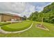 Artificial putting green with sand trap and patio at 17706 Bridlewood Ct, Parrish, FL 34219