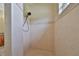 Clean and modern tiled shower with sleek fixtures, offering a spa-like experience in the comfort of home at 17706 Bridlewood Ct, Parrish, FL 34219