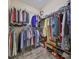 Organized walk-in closet with ample storage space, shelving, and hanging racks for clothing and accessories at 17706 Bridlewood Ct, Parrish, FL 34219
