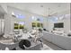 Airy living room with sleek furniture, high ceilings, and expansive windows bringing in ample natural light at 2234 Hibiscus St, Sarasota, FL 34239