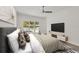 Comfortable bedroom with a king bed, TV, and sliding glass doors offering views of the pool and backyard at 2234 Hibiscus St, Sarasota, FL 34239