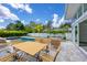 Inviting outdoor patio with a pool, seating, and a lovely backyard setting, perfect for relaxing and entertaining at 2234 Hibiscus St, Sarasota, FL 34239