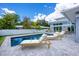 A beautiful backyard pool area featuring lounge chairs and ample space for relaxing and enjoying the outdoors at 2234 Hibiscus St, Sarasota, FL 34239