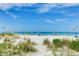 Beachfront view with umbrellas and ocean at 2310 Gulf N Dr # 104, Bradenton Beach, FL 34217