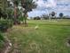 Beautiful backyard featuring a great egret standing on healthy green grass at 7673 Fairway Woods Dr # 706, Sarasota, FL 34238