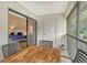 Screened balcony with a table and chairs and a view of the main bedroom at 7673 Fairway Woods Dr # 706, Sarasota, FL 34238