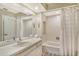 Bright bathroom features a full tub, shower, and large vanity for convenience at 7673 Fairway Woods Dr # 706, Sarasota, FL 34238