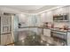 The kitchen showcases modern appliances, white cabinets, and sleek countertops at 7673 Fairway Woods Dr # 706, Sarasota, FL 34238