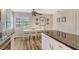 Bright eat-in kitchen features a breakfast table and a view of the garden at 7673 Fairway Woods Dr # 706, Sarasota, FL 34238