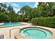 Inviting community pool and spa combo for year-round enjoyment at 7673 Fairway Woods Dr # 706, Sarasota, FL 34238