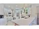 Modern white kitchen with stainless steel appliances and quartz countertops at 815 Hickory Glen Dr, Seffner, FL 33584