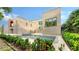 Luxury home with inviting pool, spa, and patio, perfect for entertaining at 2945 Pyrula Dr, Longboat Key, FL 34228