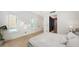 Spacious bedroom with light hardwood floors and walk-in closet at 2945 Pyrula Dr, Longboat Key, FL 34228