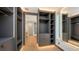 Spacious walk-in closet with custom built-ins and LED lighting at 2945 Pyrula Dr, Longboat Key, FL 34228