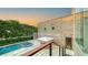 Luxury pool and spa with outdoor dining area and patio at 2945 Pyrula Dr, Longboat Key, FL 34228