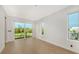 Bedroom with sliding glass doors leading to a balcony at 2945 Pyrula Dr, Longboat Key, FL 34228