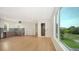 Open concept kitchen with sleek cabinetry and hardwood floors at 2945 Pyrula Dr, Longboat Key, FL 34228