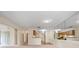 Open living room with mirrored wall and view of kitchen at 4109 66Th Street W Cir # 4109, Bradenton, FL 34209